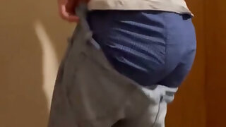 Putting on my skinny jeans and adjusting my boxer shorts while sagging a bit