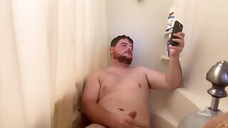 He shoots his cum load while taking a shower