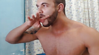 Handsome muscle hunk shoots a big load and tastes his cum