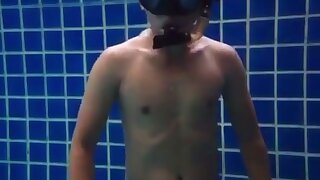 Man breath holds in speedo and snorkel gear