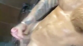 Handsome muscle dude showers