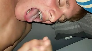 Cute twink swallowing his own cumshot.