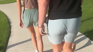 Gay dude with PAWB walks behind his friends on campus
