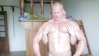 Father and son touch each other's pecs