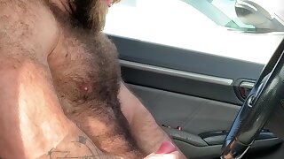 Hairy daddy bear rubs one out in gym parking lot