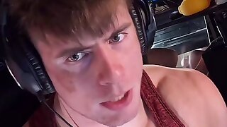 He gets horny on live stream and starts rubbing his cock. Check the reflection