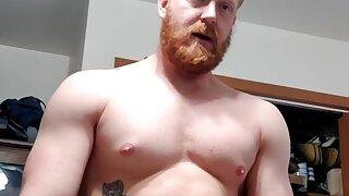Redhead hunk fucks his toy and cums