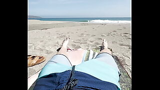 Teen jerks off on public beach