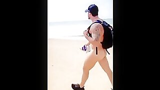 Brazilian muscle daddy takes his huge cock for a walk along the beach