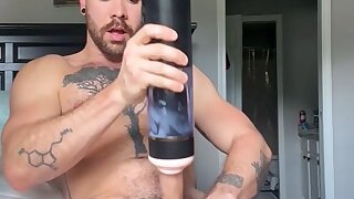 Cute guy fucks his new fleshlight and jerks out a load on bed
