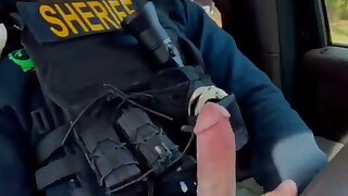 Blond cop jerks his cock in the car