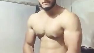 Muscular fit solo middle eastern male stroking thick cock