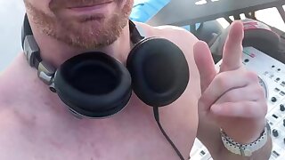 White bearded naked DJ dancing