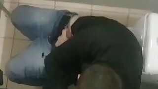 Man gives blowjob in bathroom