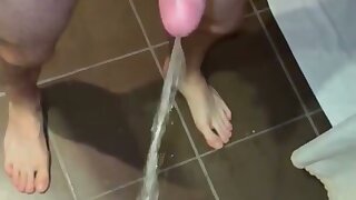 Big uncut cock pissing