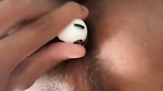 Putting an object in his hairy hole