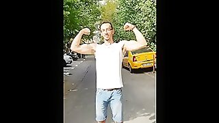 Fit Man flexing Muscles in PUBLIC