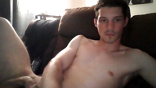 He jerks off his cock until cumming thick loads on his stomach